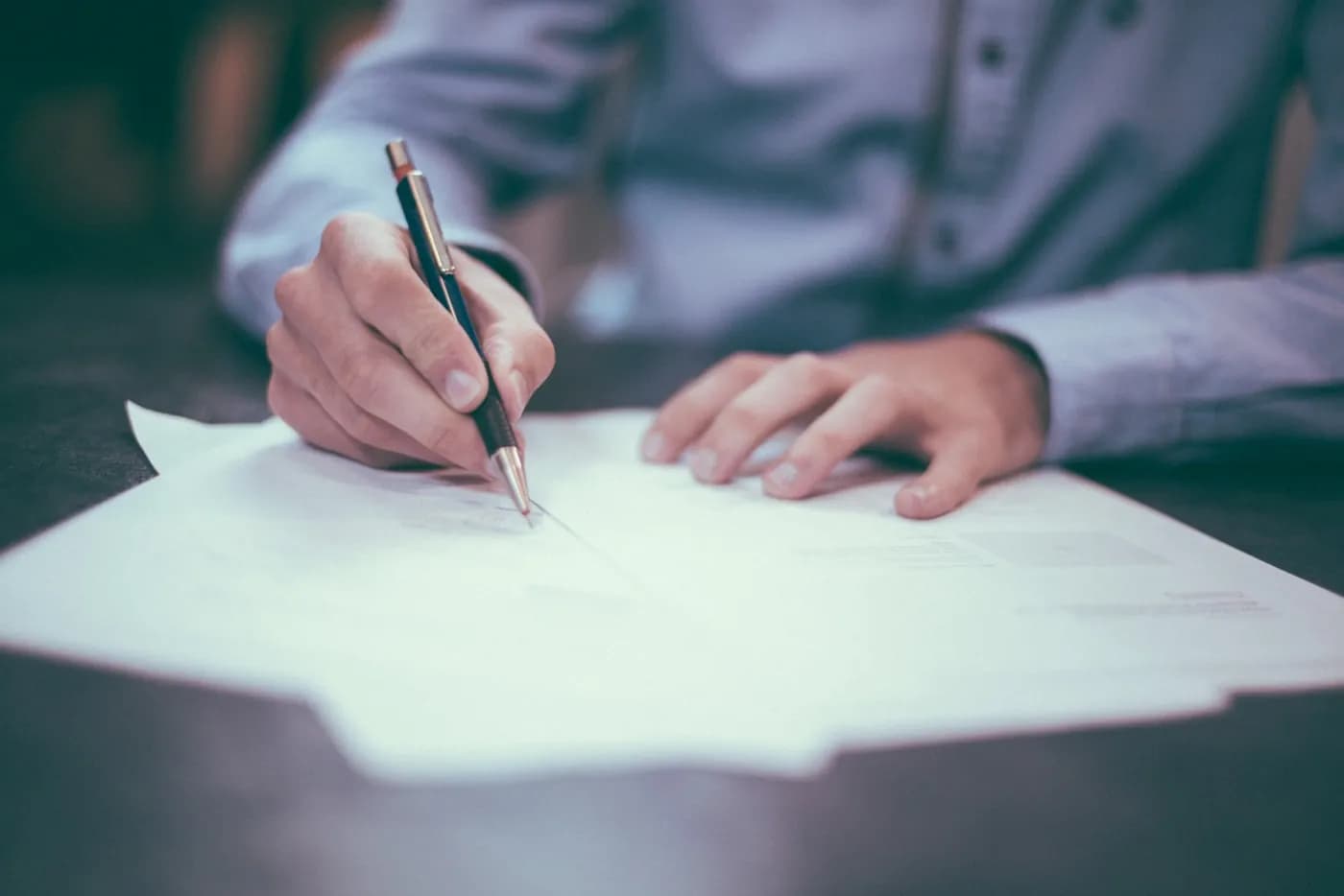 A business owner reviewing plans at their desk